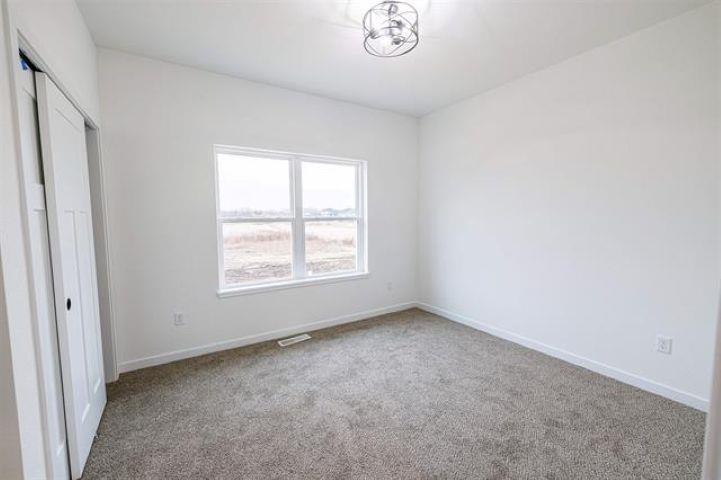14212 Prairie Commons Lane South Beloit, IL 61080 - Photo 21 of 23 an empty room with a window