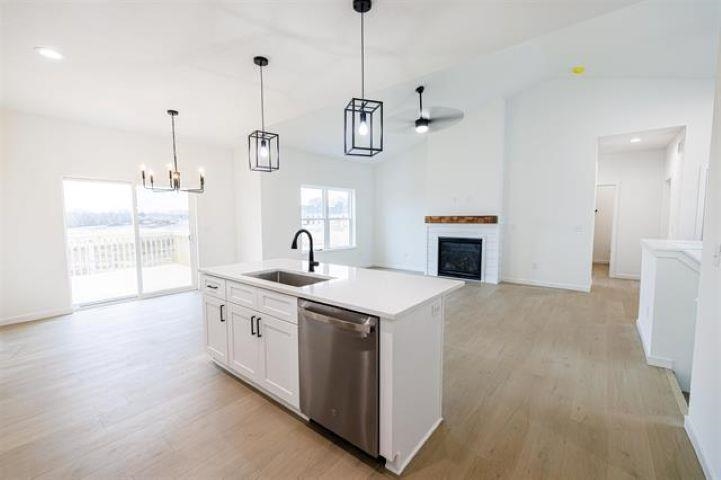 14212 Prairie Commons Lane South Beloit, IL 61080 - Photo 8 of 23 a kitchen with a sink and a stove top oven