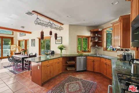 a bedroom with a bed and ceiling fan