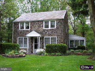 a front view of a house with a yard and porch