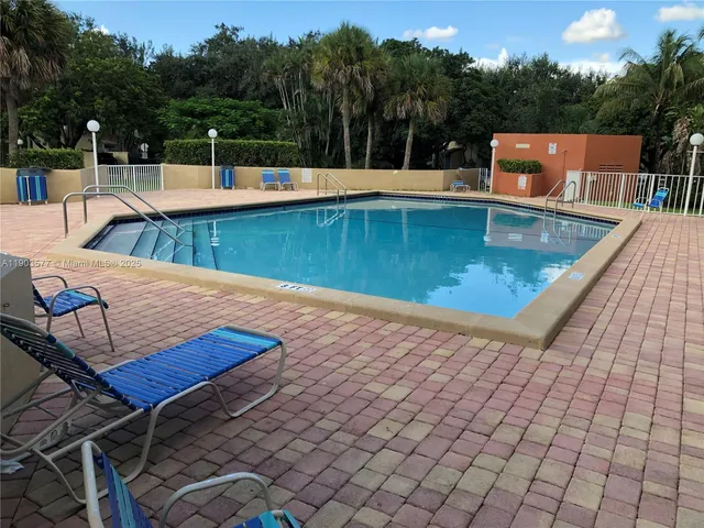 a view of a swimming pool with a patio