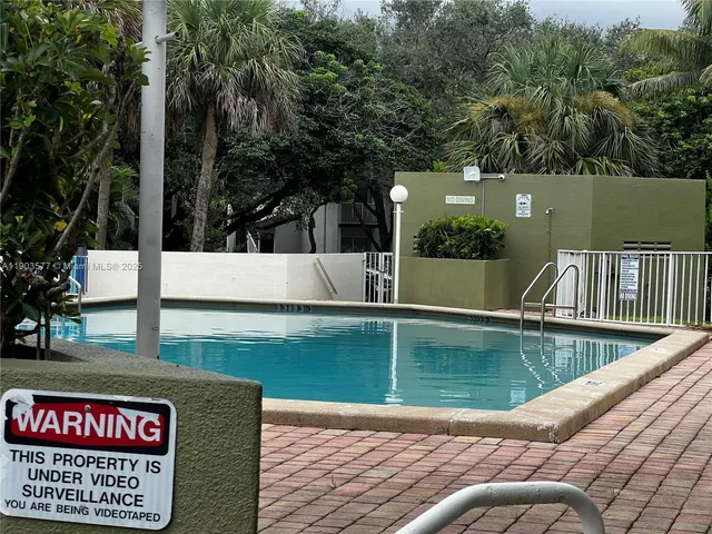a view of swimming pool with a yard