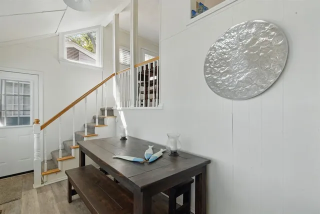 a view of entryway with wooden floor