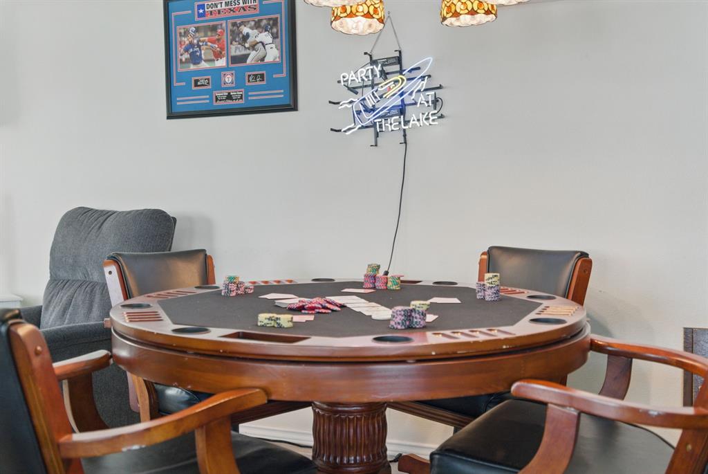 306 Chism Trail Gordon, TX 76453 - Photo 23 of 38 a view of a dining room with furniture and wooden floor