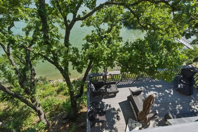 a view of a backyard with sitting area