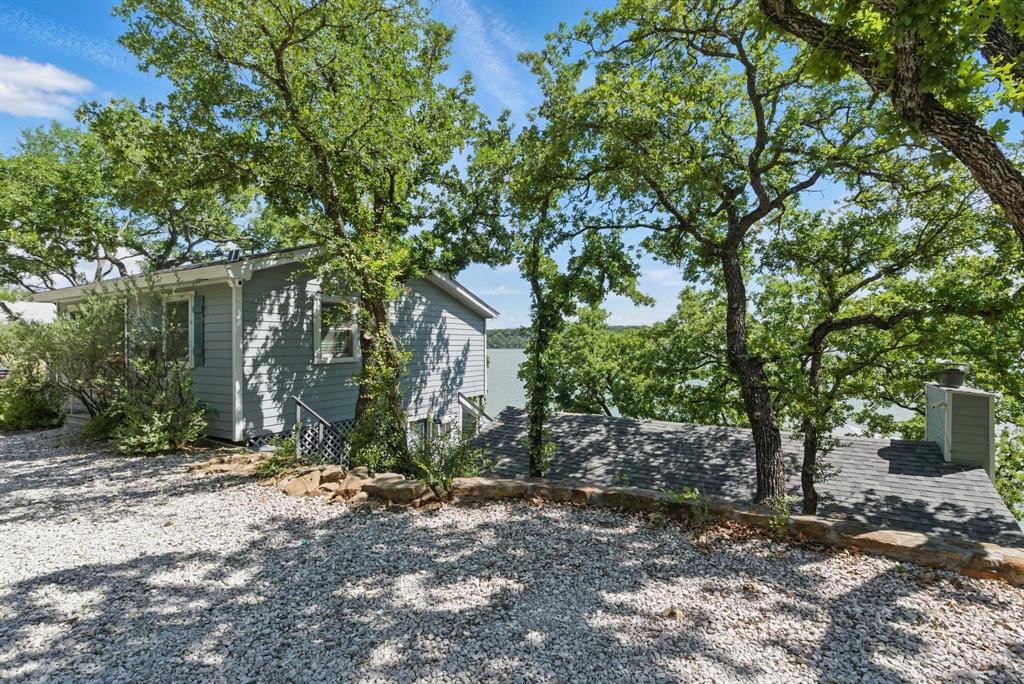 306 Chism Trail Gordon, TX 76453 - Photo 3 of 38 a view of a house with a tree