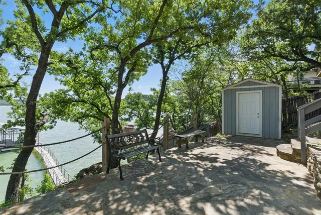 a view of a house with a tree