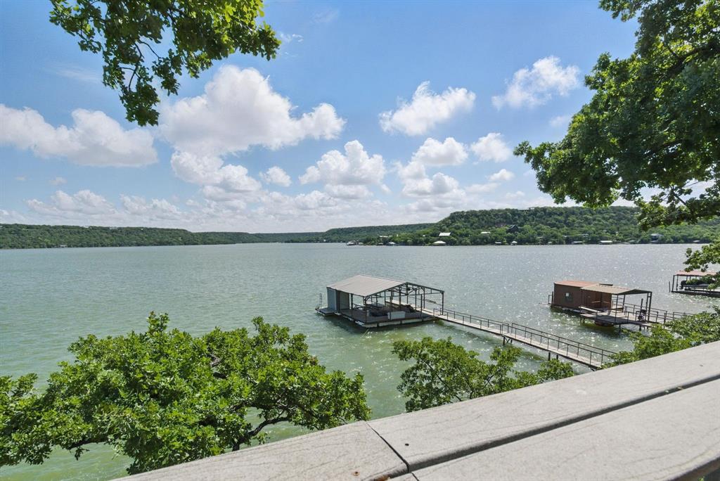 306 Chism Trail Gordon, TX 76453 - Photo 32 of 38 a view of a lake with houses in the back