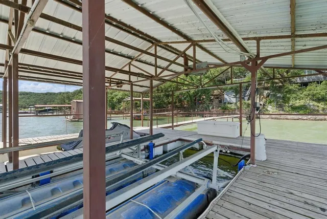 a view of a balcony with wooden floor