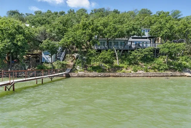 a view of a pool with a yard