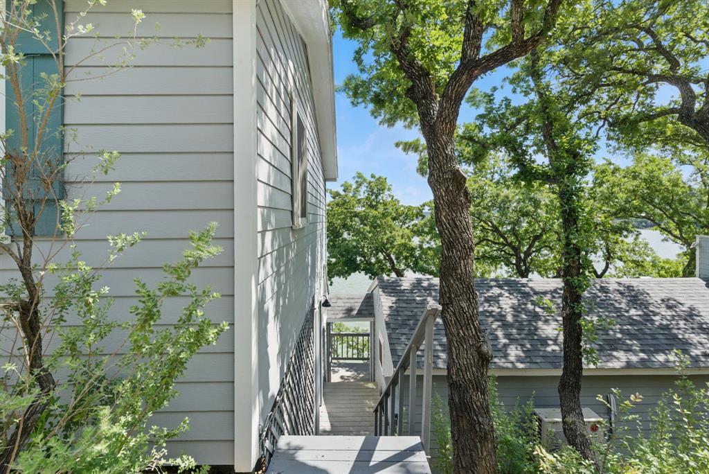 306 Chism Trail Gordon, TX 76453 - Photo 7 of 38 a view of a house with a tree