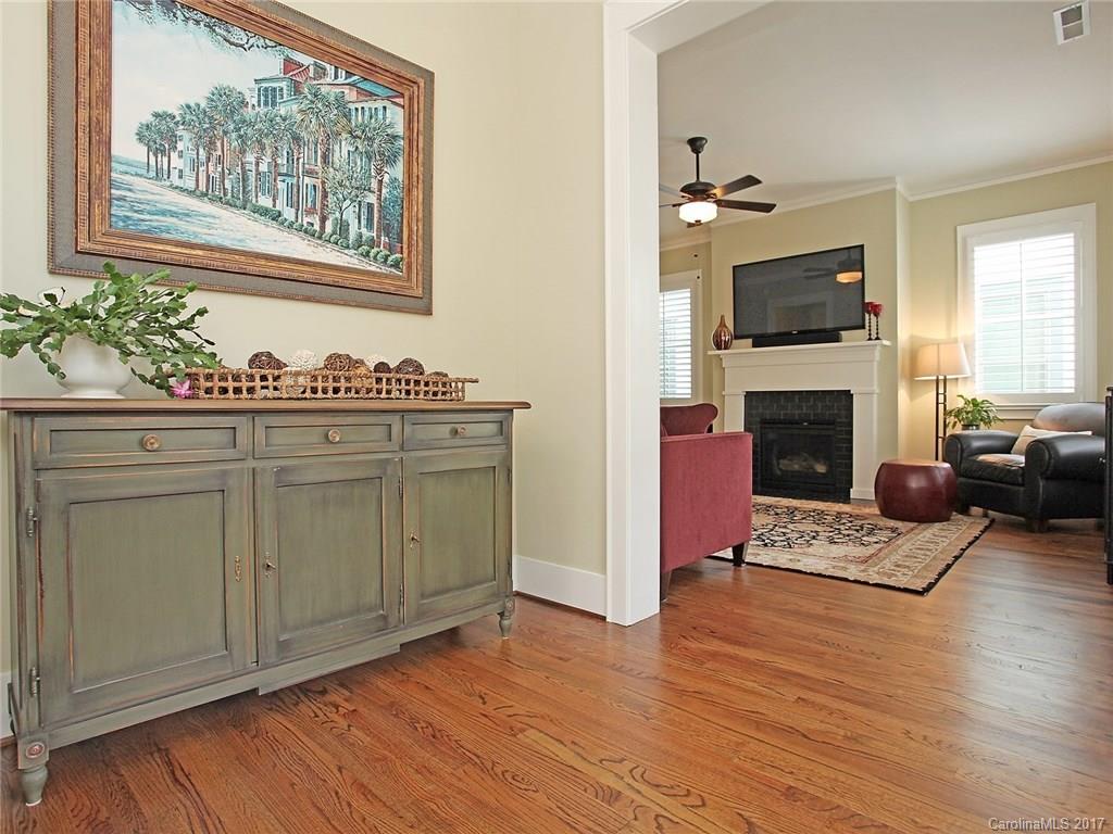 409 Hollyhock Lane Fort Mill, SC 29708 - Photo 3 of 24 a living room with furniture a flat screen tv and a fireplace