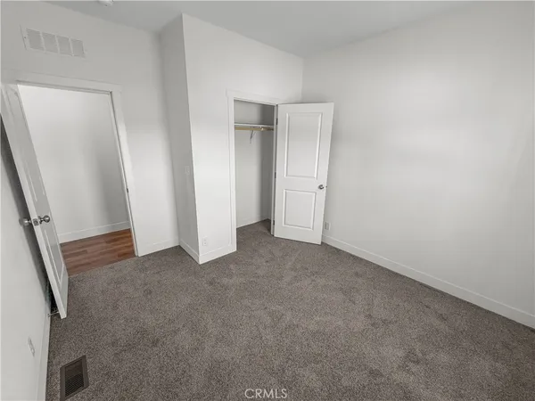 a bathroom with a sink a toilet a mirror and shower