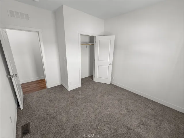 a bathroom with a sink a toilet a mirror and shower