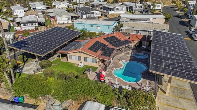 an outdoor sitting area with couch and wooden fence