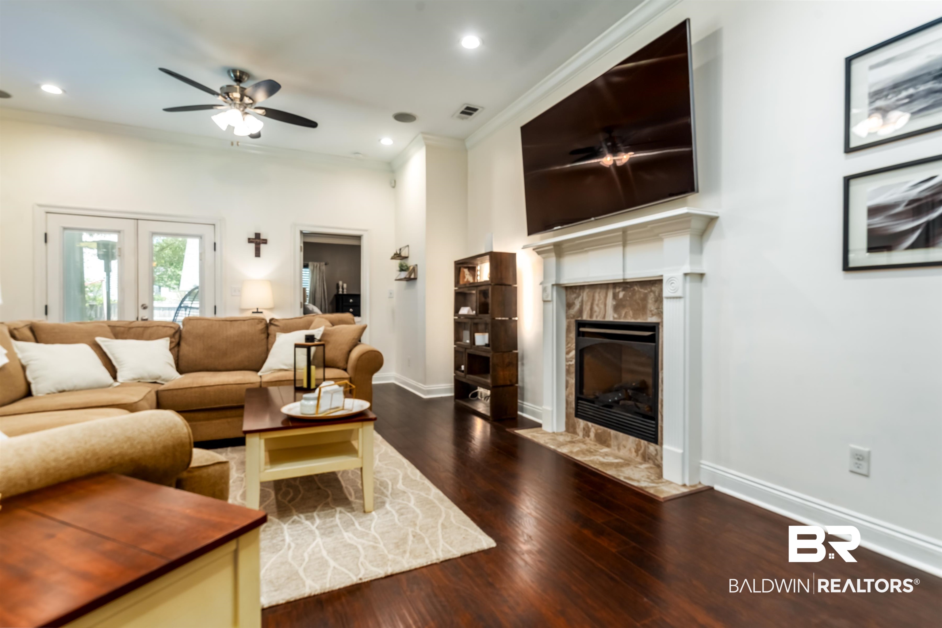 965 Henckley Avenue Mobile, AL 36609 - Photo 6 of 30 Living room featuring a fireplace, crown molding, and wood-type flooring