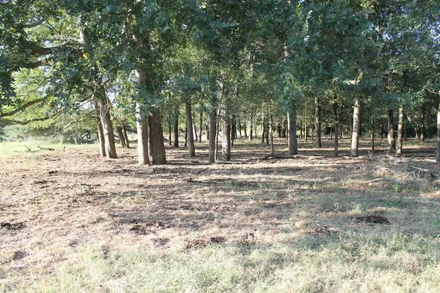 a view of a lake view with houses in back