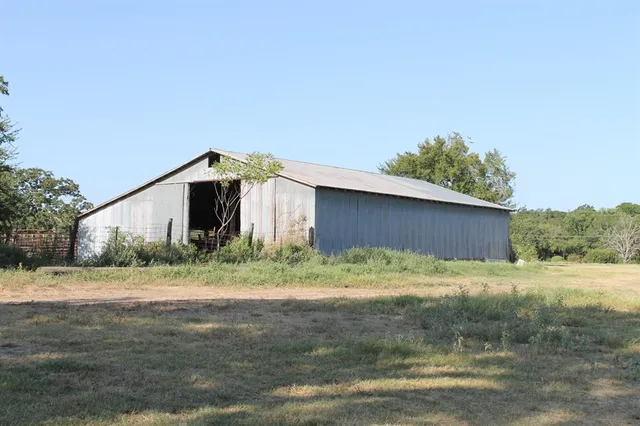 a house with swimming pool in front of it