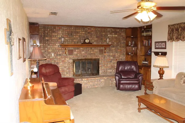 a dining room with furniture and a window