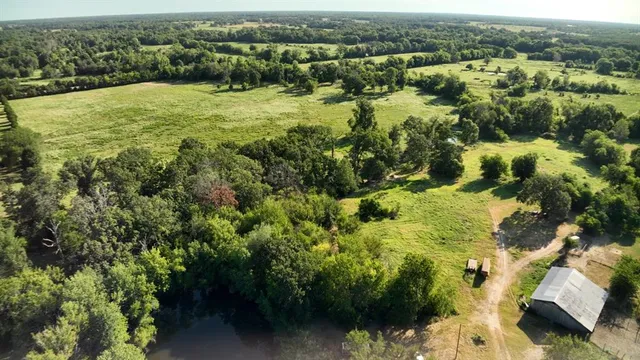 an aerial view of houses with yard