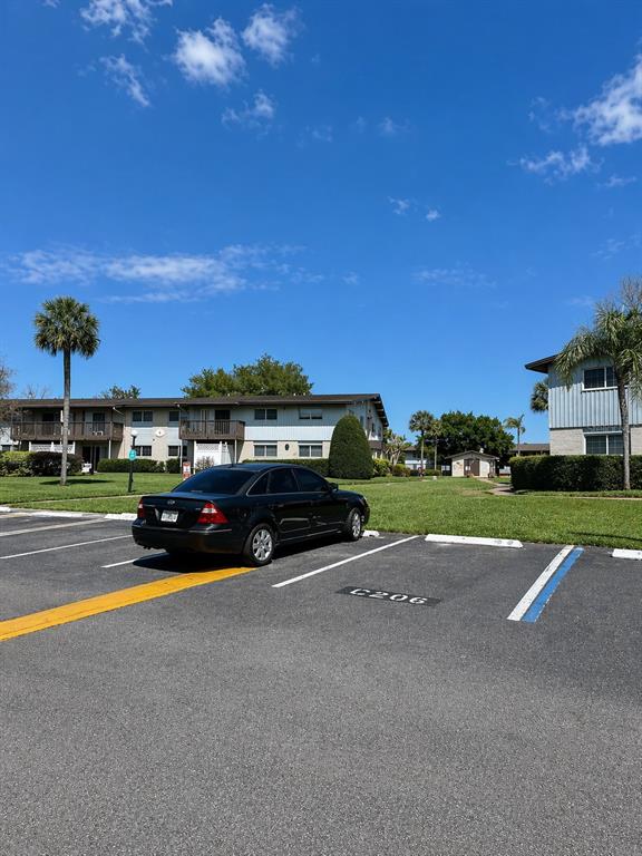 1695 Lee Road, Unit C206 Winter Park, FL 32789 - Photo 15 of 18 a view of street with parked cars