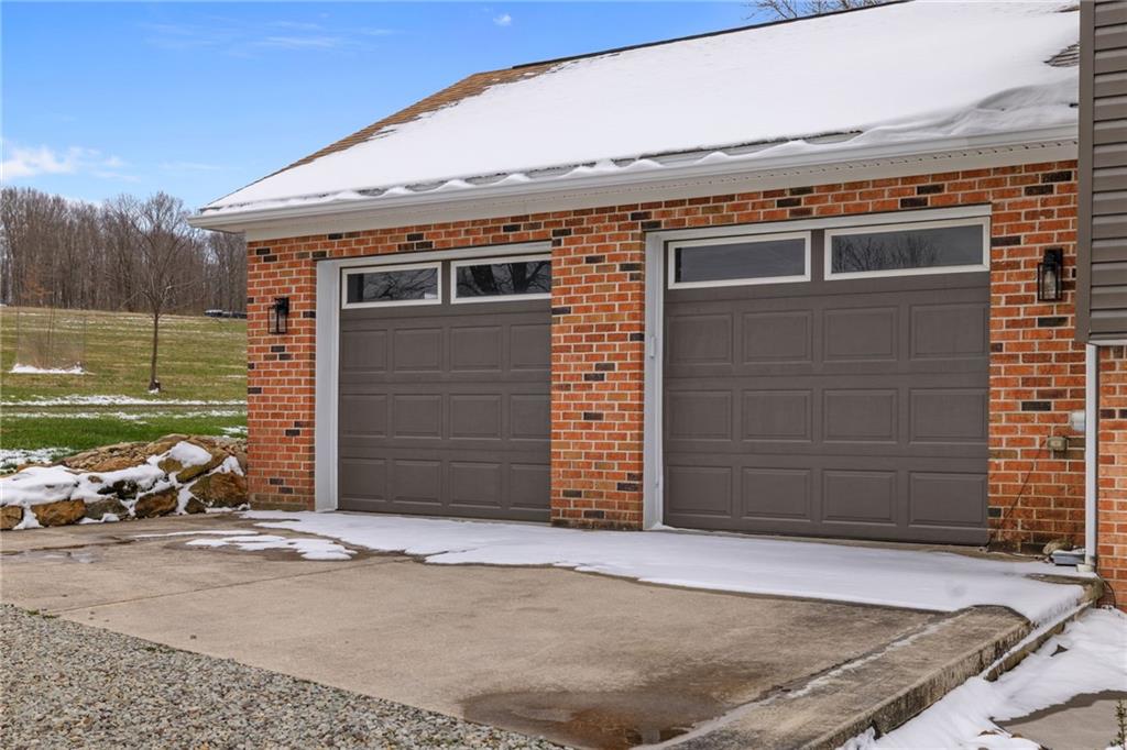147 Fike Lane Addison, PA 15411 - Photo 5 of 50 a front view of a house with a garage