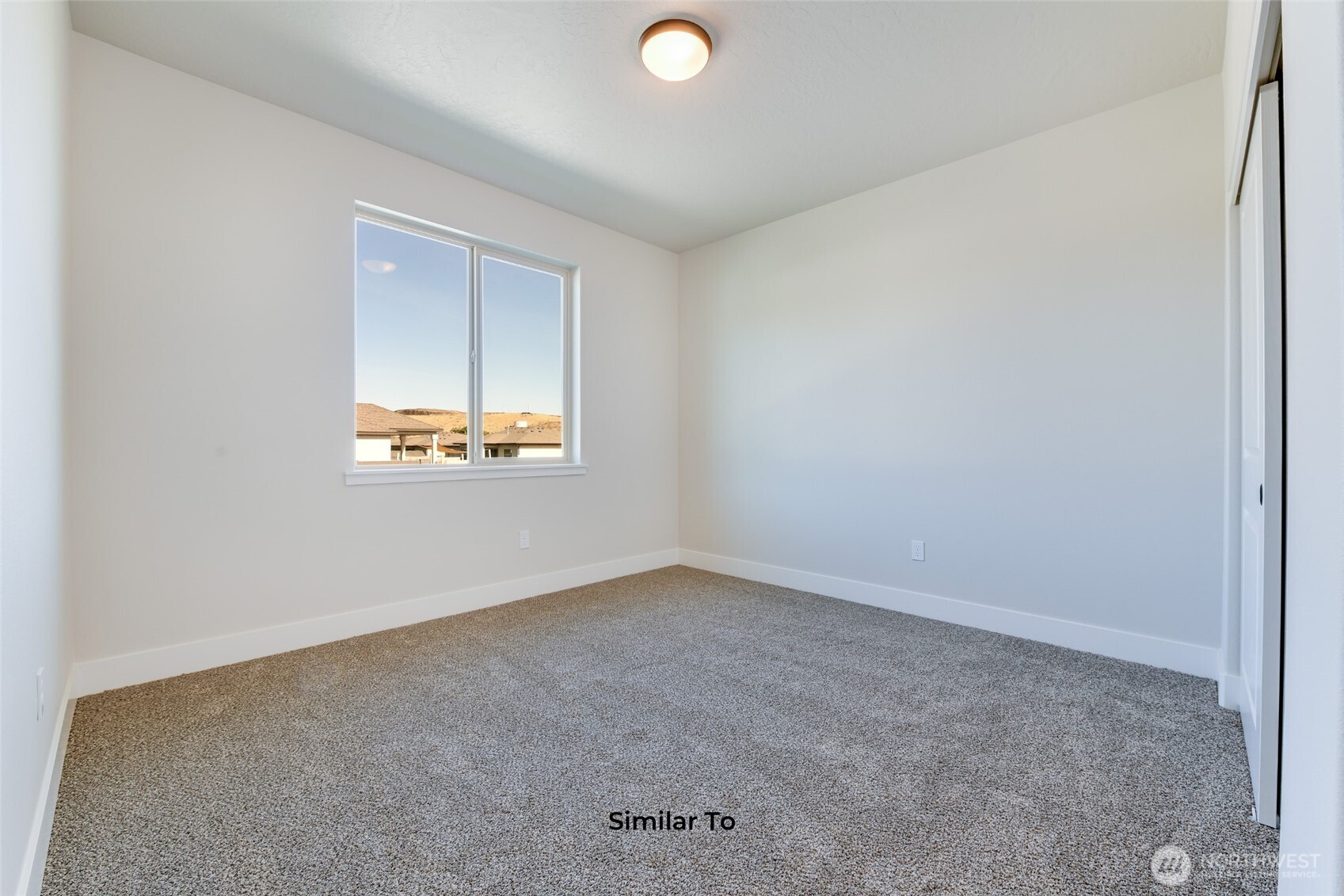 523 North Lessor Loop Moses Lake, WA 98837 - Photo 15 of 25 an empty room with a window