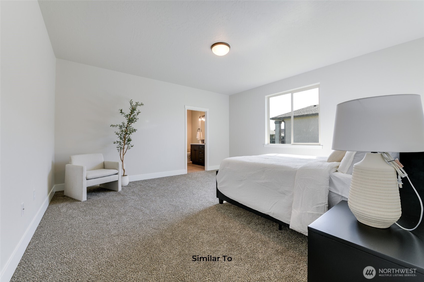 523 North Lessor Loop Moses Lake, WA 98837 - Photo 18 of 25 a bedroom with a bed and window