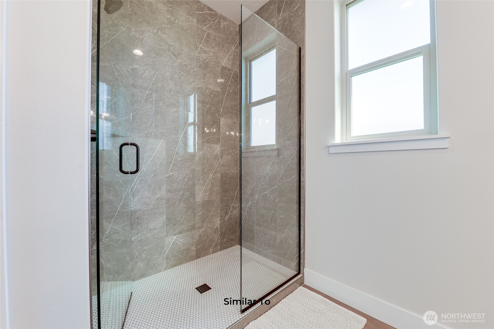 523 North Lessor Loop Moses Lake, WA 98837 - Photo 21 of 25 a bathroom with a glass shower door