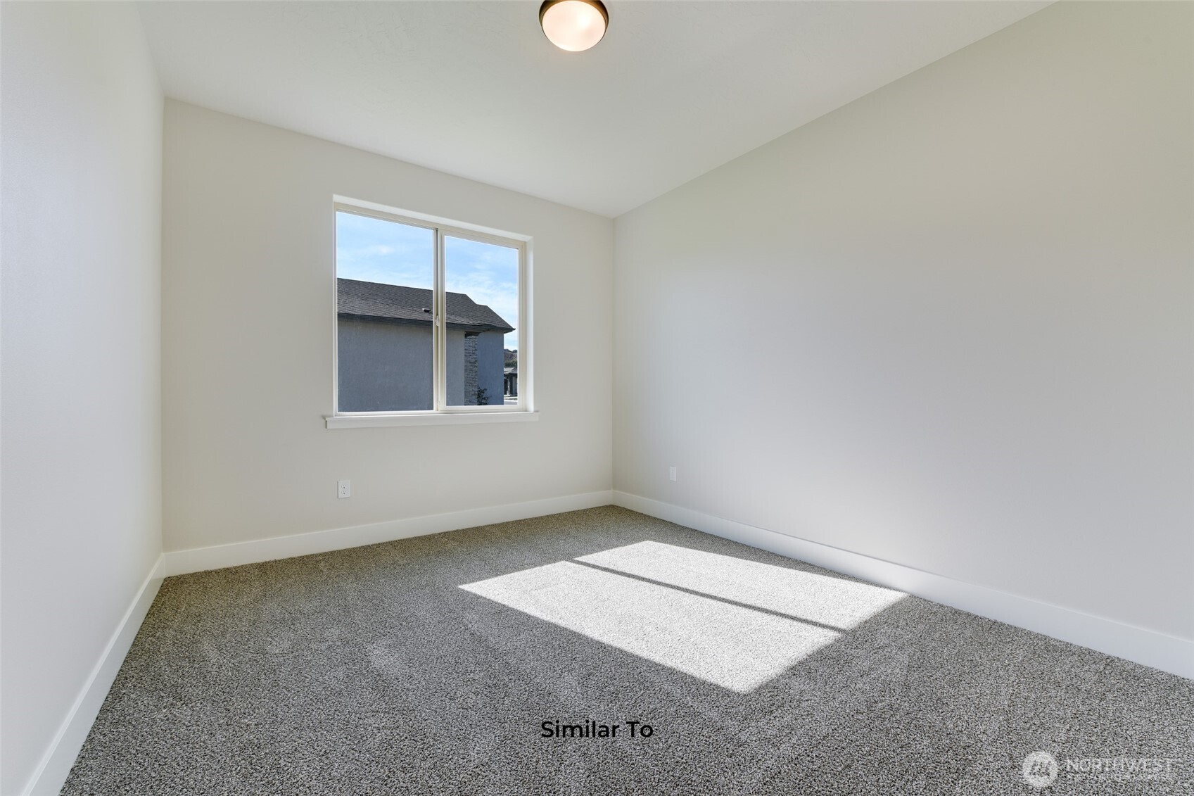 523 North Lessor Loop Moses Lake, WA 98837 - Photo 23 of 25 an empty room with a window