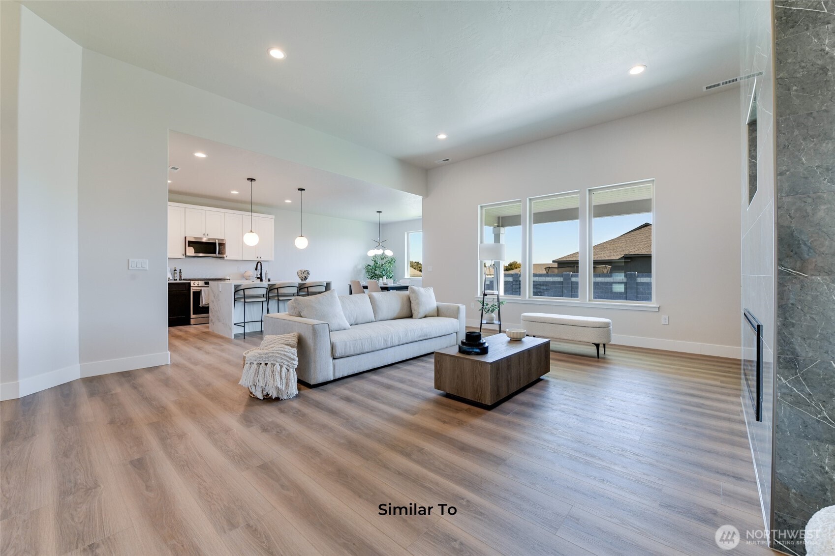 523 North Lessor Loop Moses Lake, WA 98837 - Photo 6 of 25 a living room with furniture and a wooden floor