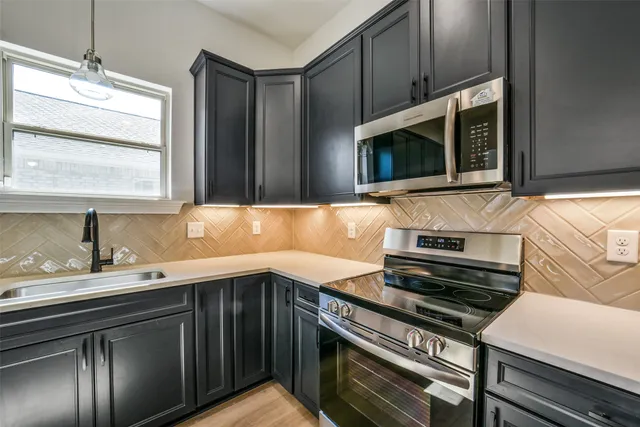 a kitchen with a stove and a microwave