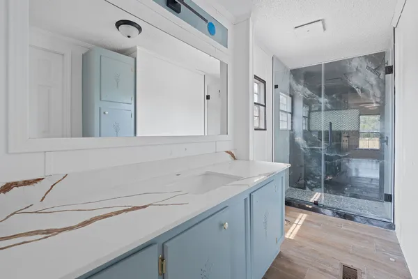 a bathroom with a sink and a mirror