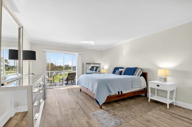 a spacious bedroom with a bed and a table