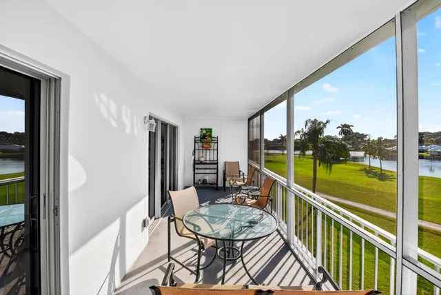 a balcony with chairs