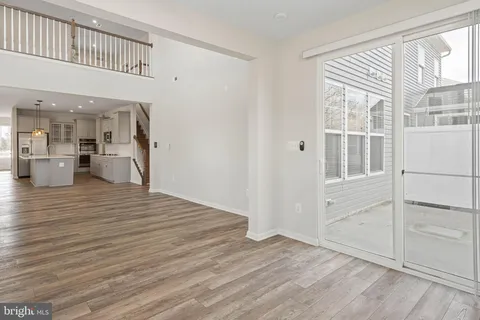 a view of an empty room with stairs
