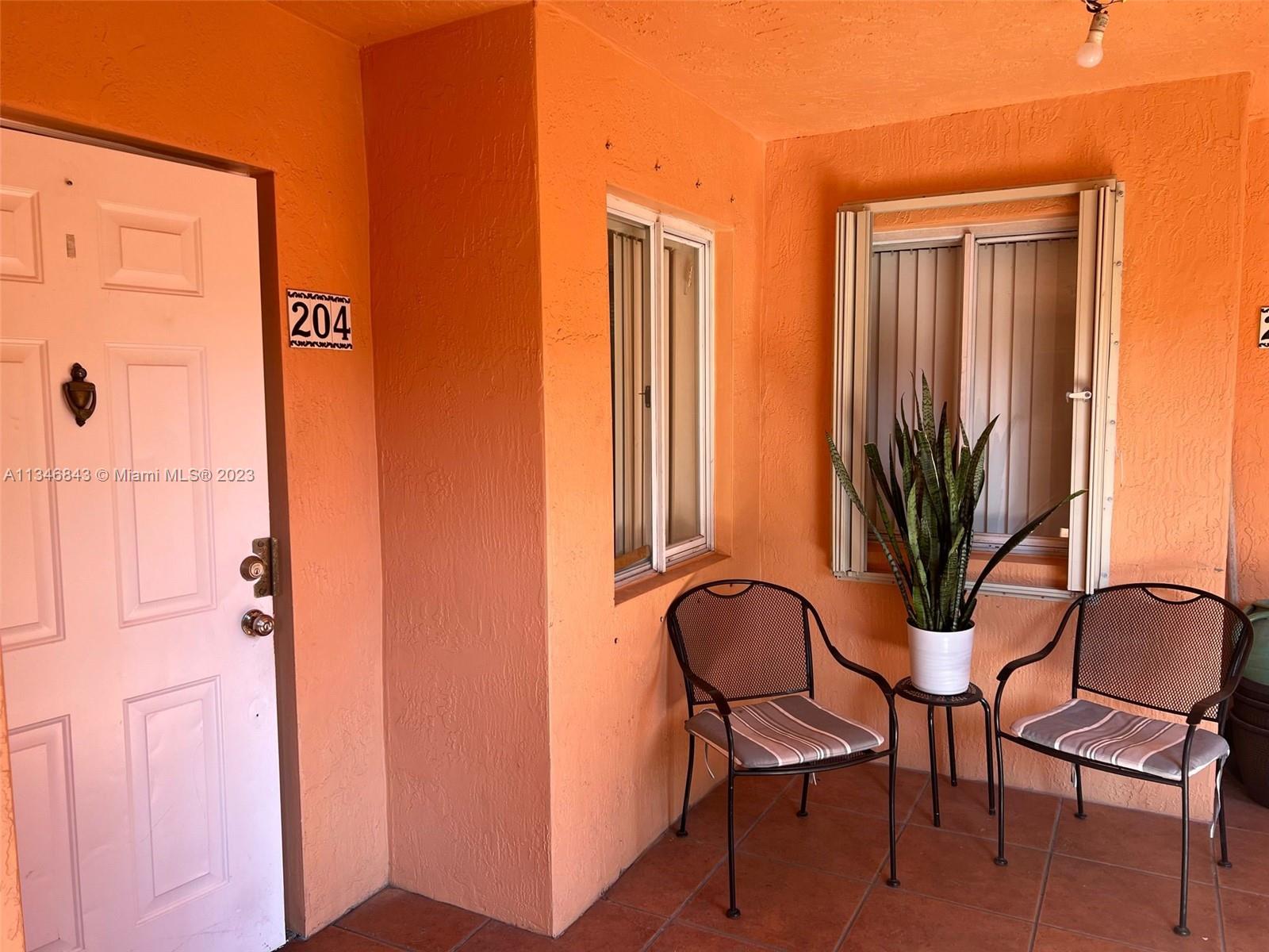 Flagami Miami, FL 33126 - Photo 4 of 14 a view of a hallway with chairs and a window