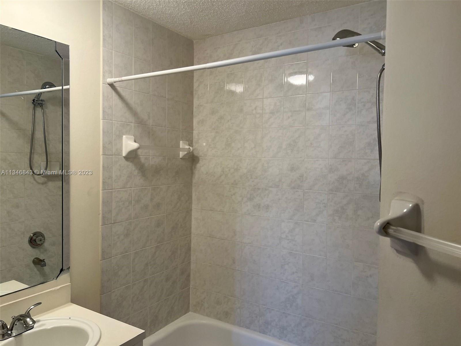 Flagami Miami, FL 33126 - Photo 8 of 14 a bathroom with a shower and a toilet sink