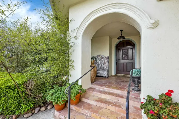 front view of a building with a garden