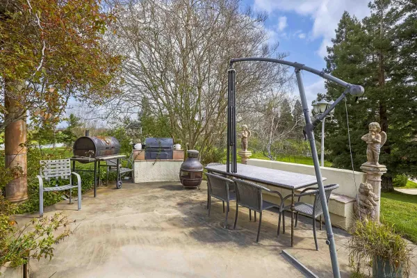 a view of a pathway of a house with a yard