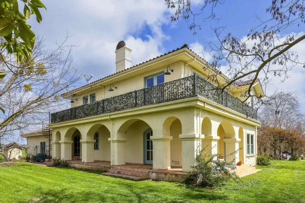 an aerial view of a houses with outdoor space and lake view