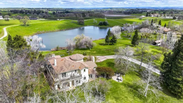 a kitchen with stainless steel appliances granite countertop a stove and cabinets