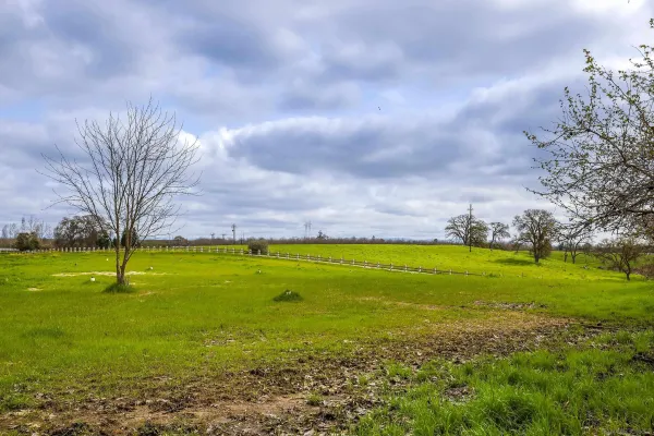 a view of a swimming pool with lawn chairs