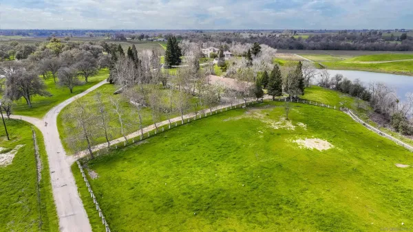 a bathroom with sink a mirror and next to a window