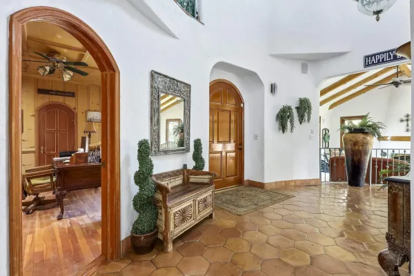 a bedroom with furniture and a window