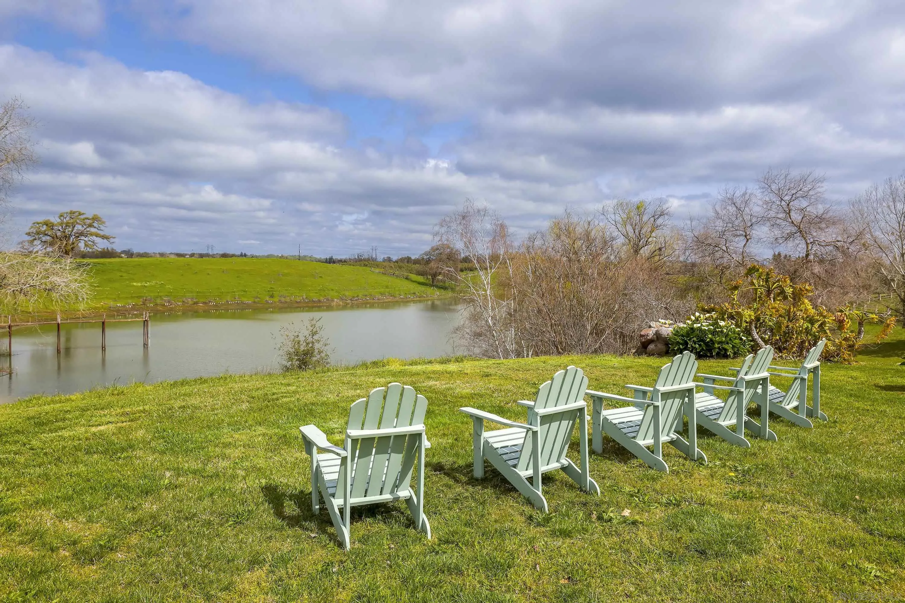 24943 North Mcintire Road Clements, CA 95227 - Photo 4 of 68 a view of a swimming pool with lawn chairs