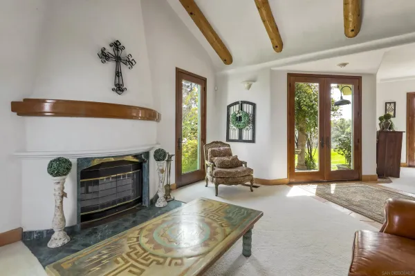 a view of a hallway with entryway and front door