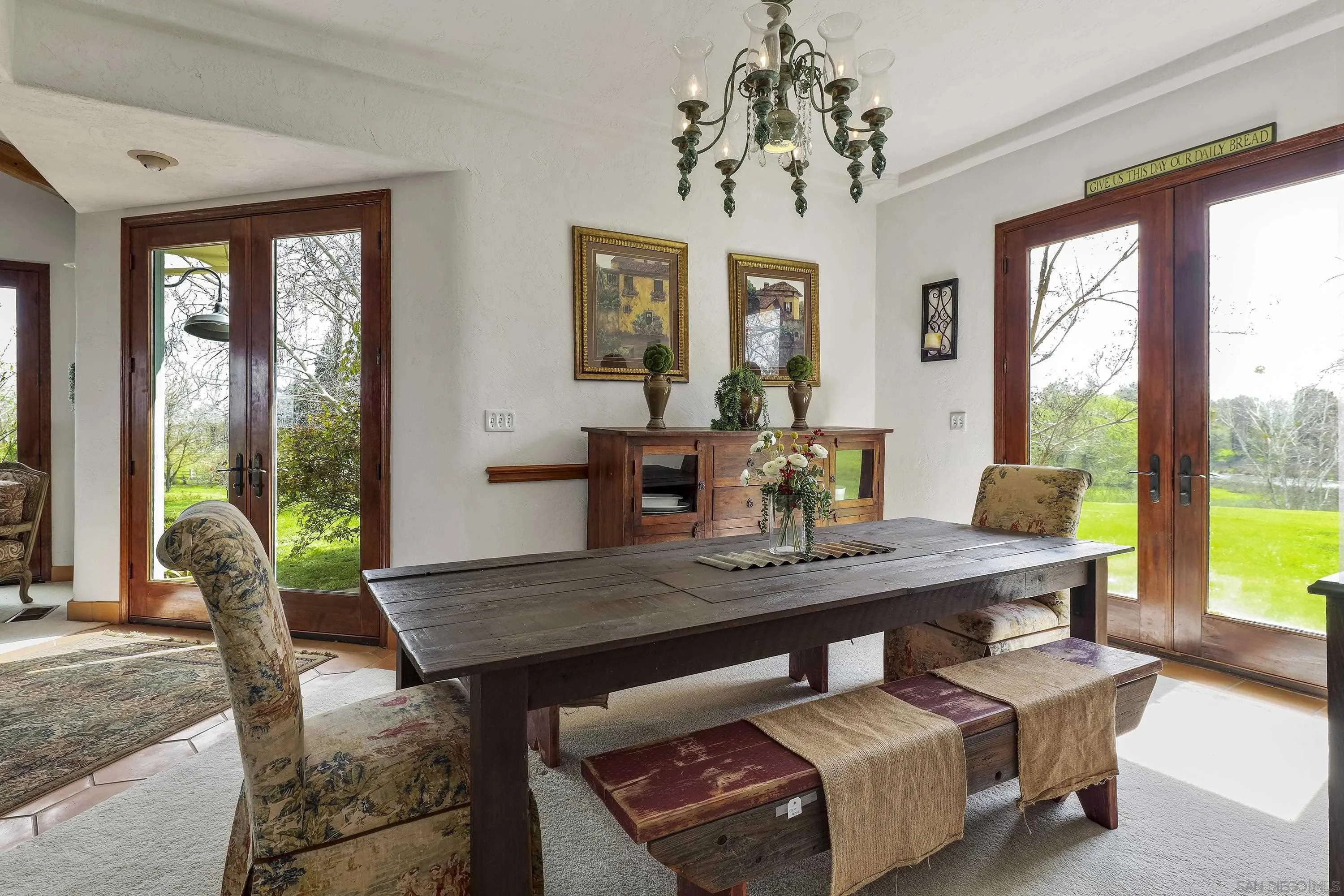 24943 North Mcintire Road Clements, CA 95227 - Photo 43 of 68 a view of a dining room with furniture large windows and wooden floor