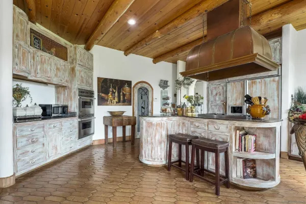 a view of a chairs and table in patio