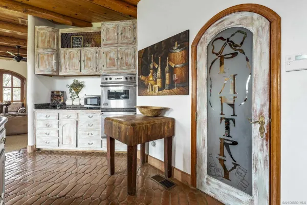 a bathroom with a granite countertop sink a mirror and a window